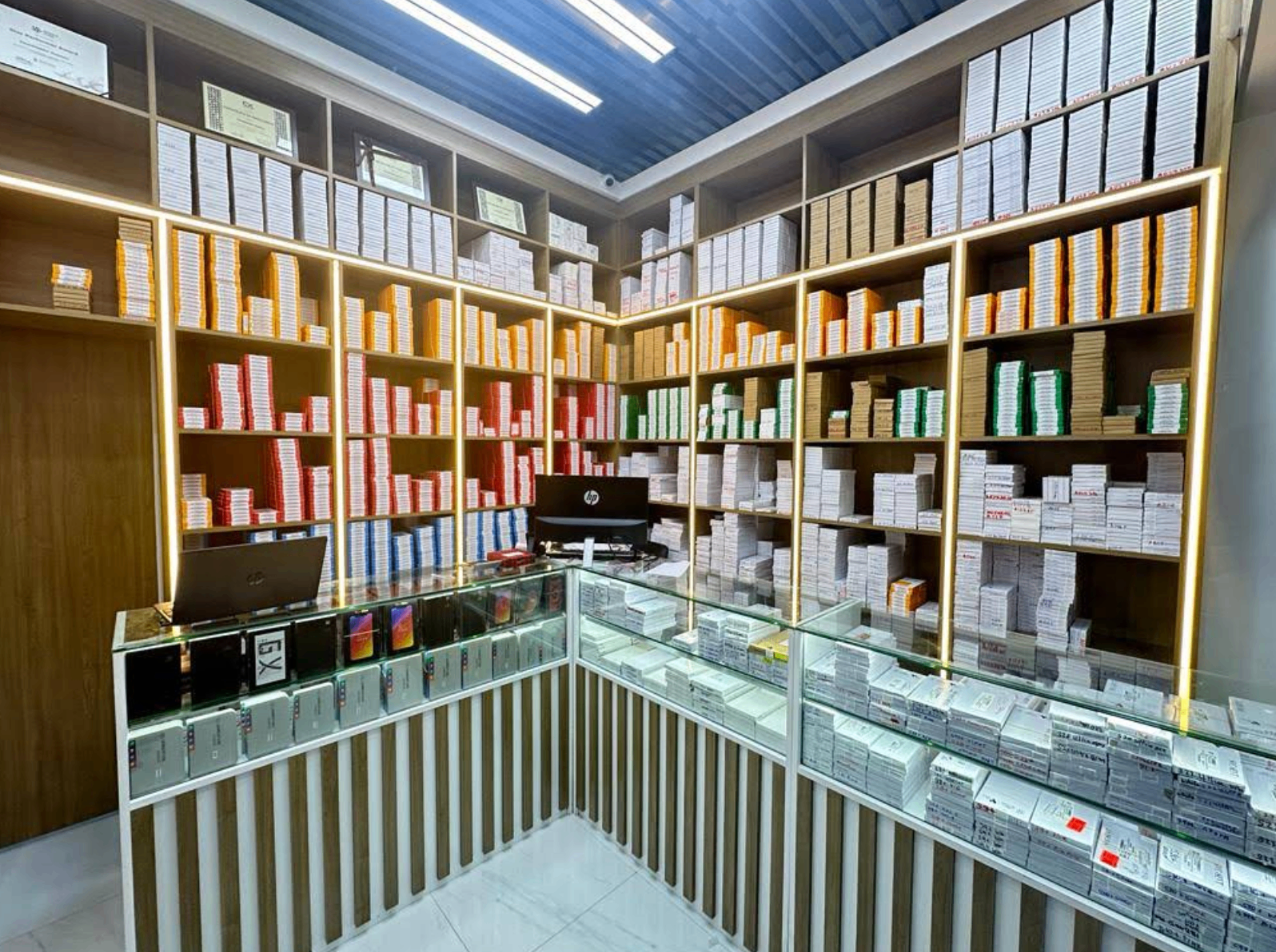 Servicepack.ae Dubai showroom shelves stocked with original mobile spare parts